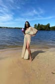 I got this in 2020 for a cruise but because of the pandemic, I wore it for my birthday at a lake house instead.  It's very beautiful in the sun! It snags easily so be careful.  It's def my favorite beach coverup and I'd love to see it in other shimmery colors like green or silver. - Aarti S.