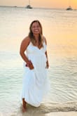 Wore this to a White Dress Party in Aruba and I'm obsessed with how it looked. Wore it on the beach and the bottom got a little wet. Normally a large but got an XL because the bust would've been really tight on a large. Perfect length too for my short self. Actually, dress had a few snags (looked like it was made poorly) but overall not noticeable in photos or by others. Would recommend! - Ana T.
