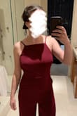 This jumpsuit is amazing! Love the adjustable straps on the top and it's fitted while still feeling like there's room to move around. Only downside is the legs are meant for a 6'5 person so I got them hemmed to fit me but that's no issue for me. Otherwise love the fit and style, it's thick enough not to show panty lines and I can't wait to wear it to an upcoming rehearsal dinner for a wedding. - Sydney D.