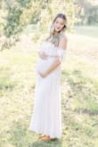 I wore this for maternity photos and it was perfect but I know it will fit just as good post baby and I'm so excited to wear it again! - Shelby L.
