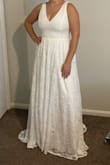 I'm so excited! This fit like a glove. No alterations needed. This is very flattering on my hourglass shape since it hugs my waist. I am a broader, large chested build and I was so happy to finally find a gown that flattered my figure. The train is very pretty, but not too long. I don't get snagged or trip in this dress. I'm 5'7" and I will wear 3 in heels to avoid having it hemmed. - Cary S.