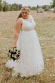 I loved the dress. The only alterations I had was hemming the bottom to fit my height and I added a belt to go over the one on it as the beads were not the style I wanted. I also wore a underskirt to make it bigger for photos. Wonderfully comfortable and light weight. - Angela W.