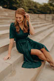 The color of this dress is amazing. Wore it for our engagement pictures and I LOVE. Great quality material but will wrinkle easily. Must buy! - Emma F.