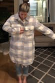I am not sure if it was a miss-print on the size but I ordered a small and from the photos, you can see I am swimming in the jacket. The length goes to my calf and I could fit another person in the jacket with me. I am typically a Small-Medium in everything Lulus so the size of this jacket shocked me. This jacket is no longer available or I would try an XS and see if it was any better but sadly they went out of stock within days of launching their fall collections.   

The material is very flexible, soft and, if the fit was better, would be awesome and the reason I gave it 2 stars, But I can not get over the fact that it is so ill-fitting. - Nicole K.