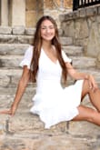 So my daughter basically wears a XS however, mom was tired of looking for white dresses and ordered the small. Had I ordered the XS it would have been perfect. I ordered the wrong SIZE so it was totally my fault regardless the dress was flawless and received so many compliments. Material was awesome I threw it in the dryer on dewrinkle because their was some miscommunication on who would take it to the cleaners. - Monica