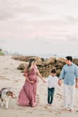 Had a perfect maternity shoot with this dress! I did have to go up one size because the chest part was too tight in a small although the rest of the dress fit, even around my big belly. - Tenysha C.