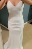 I got so many compliments on the dress. It was perfectly simple. Just what I wanted. I added a veil to complete the look. Great quality. It was not heavy, easy to move around in, soooo comfortable. I had to get it altered and cut a few inches from the bottom and had the straps shortened as well, other than that no other adjustments needed. Absolutely loved this dress! - Mayra D.