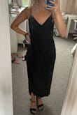 As someone who is very short and petite, but also has a larger butt and thighs, it can be hard to find dresses, especially ones that need to be appropriate for a wedding or something more formal. This dress works great. Like others have said, it is definitely not a midi dress since I am only 4'10", but the length honestly looks great. Don't even need heels but with them it looks even better. The material is a little bit thin for the price so I will need to iron out the wrinkles. Also the slit gives it a little something to not make it just another plain black dress. I will say if you have a larger waist/rib cage or a bigger chest maybe size up because it was a little tight on me and I am flat lol - Jennifer C.