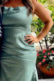I wore this to a wedding over the weekend and got endless compliments on it. I wore shapewear underneath but you honestly probably don't need to with the way the dress fits - I have a little bit of a gut but the material is sleek and almost baggy and was very flattering for my body - I'm 5'2 but curvy and busty, and it made me look tiny! :) The fun pattern is an added bonus, and the color you can't beat. Just such a unique but gorgeous dress. highly recco. - Jillian C.