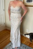 This is THE DRESS! The L fits perfectly, though the lining tends to bunch up just a bit. I am still losing weight, so I figure that will either resolve itself by my getting thinner, or by the fabric stretching a bit. It is a bit more beige than appears in the online photos, but since this is my second (and final!) wedding, I don't want a pure white dress, anyway. The length is absolutely perfect, and I won't need to have it hemmed at all. I am fairly tall, and am wearing 2 1/2 inch heels in the photo, and you can see my toes and a bit of the shoe. This dress is very flattering, lightweight and comfortable, and I feel beautiful in it, just like a bride should feel! I added a sparkly bridal sash from Amazon to complete the look (seen in my photos). Absolutely stunning! - Debbie S.