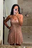 Bought this dress for Vegas and it fit perfect (no adjustable straps). My concern is since it has a flowy skirt is that my booty would be showing anytime I bent down so sadly has to return. - CARLA D.