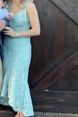 Very pretty dress but wasn't the material I thought it would be - kind of stiff feeling, not stretchy, and not very soft. I'm not sure an XS would fit but the small was definitely loose on me. I received SEVERAL compliments on the dress though - everyone else seemed to love it! - Megan M.