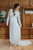 The dress is so beautiful, I got many compliments (and people can´t even imagine I bought it online and for the price). I was hesitant to order my wedding dress online while pregnant (because I didn´t know what I would actually measure in my wedding), but it turned out great! Pre-pregnancy I'm usually 5'4 and 120 Lbs. I spoke to the Bridal team at Lulus, and they suggested I order a size large (I'm usually a Medium. I believe if I hadn´t been pregnant, my usual size would have been perfect. As it was, I had to alter the dress a bit (had the sleeves narrowed and hemmed a little), but my midsection was perfect fit perfectly and looked pretty great (the baby didn´t even show that much). The other alteration was adding a tiny button in the back to pick up the train and not step on when dancing.
The dress is comfortable, flattering; the fabric and lace are beautiful, it works well for a fall or winter wedding.
I loved it, and I can't believe I got away with getting such a bargain for my wedding! - Maria C.