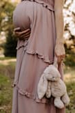 I got a medium because I am currently pregnant (37weeks) and it was plenty big. I honestly could have gotten a small my normal size and been fine or even maybe an xsmall not pregnant. Regardless I loved the dress and it was perfect for pictures. - Sabrina P.