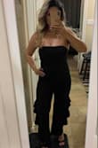 I love this jumpsuit is super cute and sexy. 
Have  a little be of stretch on it. - Elisandra O.