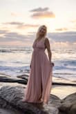 I used this dress for engagement photos on the beach. It was PERFECT. Flowy, lightweight, elegant, just flawless. I felt like a princess.
Lots of length, beautiful color, and great quality!! it held up even after hours shooting pictures in the ocean and then being stuffed in a suitcase and flown home without washing.
Fitting tips- The small fit PERFECTLY for my height and weight but was about an inch too tight on my ribs where the zipper is, and is it not stretchy! I had to return it and get a medium. So if you are more than a 34" bra, as I am a 36", the small might be too tight around the rib cage. The upper straps are on the longer side from the zipper to the top of your shoulders, and busty, so if you are shorter/ less busty in the upper body they might be a bit loose. But Nothing some tape or alterations won't fix. This dress has plenty of length to it as well, I am super tall and I could still wear 6" heels with this dress. 
Overall just an amazing dress and I want one in every color! - Erica D.