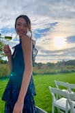 This dress is AWESOME- I wore it to a wedding at an art museum and it was the ideal vibe. It was so comfortable and great to dance in. I would DEFINITELY size down- I usually wear a medium or sometimes a small, but the XS was the perfect size for me. Might need to be hemmed for those who are shorter or average height, and may be very revealing for those who have chests on the larger end! Got a ton of comments on this and am so happy I bought it. - Claire M.