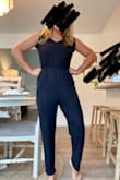 I'm super short and this hits right below my ankle so it's perfect with flags for me! I just ordered another color. Very flattering and lots of compliments - Andrea C.