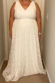 The lace is nice quality with a true white color and the dress is has a full, soft liner. I chose a different dress because I decided it would be easier to not have a train, but it's lovely. I tried it on with a standard bra. So many wedding dresses are low back, but I like that this one is more moderate for those of us that prefer to keep our back covered. I'm normally a 2X in standard clothes and dresses, but the Lulu's 3X wedding dresses fit best. - Sherry O.