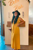 I really liked this dress. I definitely could have ordered a size larger especially in the sleeves. It was a little confusing to get into. Very flowing , fitting, decent yellow as well. - Cami R.