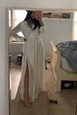 I love the cut of the dress but the V neck at the bust is very loose on me and i wish it fit tighter, however, the rest of it fits true to size, even the elastic at the waist. The material and the white color of the dress are such good quality. I can't wait to see how this dress looks in my pictures! - Misam T.