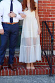 It's a cute and elegant dress. The material is cheap of course but that didn't ruin it for me. My boobs are very small and the dress dint have a lot of room for them so if you have bigger boobs, reconsider. I'm also very skinny and love that it fit perfectly. What else can I say? I wore it for my micro wedding, I was very happy with it and everybody complimented me. Also love how it looks in the pictures. - Kyle M.