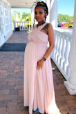 I was looking for a somewhat loose fitting piece in the stomach area that could fit around my belly. I don't like buying maternity clothes so I always buy a size up. I'm very short so I had to get the dress hemmed. The dress itself was soooooo beautiful! I felt beautiful wearing it! The material is great and well made. - Danielle L.