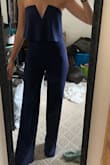 This jumpsuit fits perfectly! I have a small chest and waist with slightly fuller hips and was torn between a small and an xs. So happy I went with xs! The top stays up and fits like a glove to the rest of my body. It is slightly long but is perfect with heels or wedges. Highly recommend! - Michelle W.