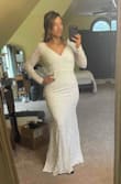 I ordered this on a whim bc it was on sale. I figured how awesome would it be if I found a super inexpensive wedding dress early. I will preface by saying I love lulus, and they always have amazing quality pieces.
This dress is gorgeous. I love the fit, the back detail, it's very cute. I would say it's on the more simple side though. I would definitely try to find a way to embellish it, maybe with a bridal belt or something. It is definitely form fitting so you have to be into that. It's very difficult to clip the back without help. I would say you don't really need a bra with it. I might use some tape to bring the girls to life but that's preference! - Tiana J.