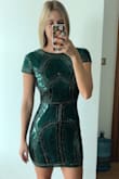 This dress is even more gorgeous in person! Beautiful beading and lovely emerald colour. Looks very classy and great for a holiday party or any special event. Purchased size small and fits great - Ashleigh W.
