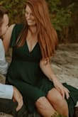I ordered this dress for my engagement photos. The color was fantastic and it was so comfortable. I ordered a medium and it fit well almost everywhere except the bust which I was expecting after reading some of the other reviews. I probably could have gotten a large. If I had worn a different bra it would have kept things more under control! But still love it. - Megan B.