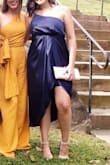 I purchased this dress as my last minute option right before a good friends wedding. I've gained a bit of weight and didn't seem to like how anything fit. The cut of this dress is great for camouflaging a gut, but the slit still keeps it sexy. I also didn't realize on the model there was a short skirt underneath. Which was also cute. My only issue is (just like with any one shoulder dress) you need to pull it up every once in a while (which I should have done before this photo). - Natalie C.