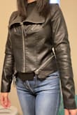 I've been looking for a fitted jacket like this and this is perfect. I read posted reviews and ordered a size up. I typically wear a size small. A medium fits perfectly for me. The arms would've been too tight if I ordered a small as it feels perfect in a medium. I don't think I could wear it with a sweater in the winter, but wore it with a knit material long sleeve shirt the other night and it was fine. You might want to go up two sizes if you want to feel more comfortable wearing any sweaters with the jacket. - Jung-yoon S.