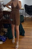 I wore this dress for homecoming and loved it! It's super light and comfortable, not itchy at all, and it has adjustable straps which was awesome since I have no boobs (dresses never fit me up top). The color shifting feature was pretty unique, the photos don't do it enough justice. No complaints from me! - Ella R.