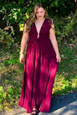 I was very excited about this dress and anxiously waited for it to restock for a wedding I'm attending. The dress is stunning but definitely runs small. I'm generally a large in every dress I've ordered from Lulus and have never been disappointed. But the natural waist on this one is definitely snug. I'm anxiously watching again to order a size up so hopefully they come back in time for the wedding. - Lauren H.