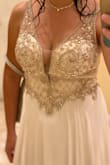 I highly recommend this dress. The top part fit perfect because you can tie it tight in the back. I just needed to get it hemmed because I am short. It's way more gorgeous in person. - Christina C.