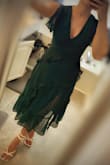 I love this dress! I ordered the green in XS and the blue in S. After reading reviews I was convinced I wouldn't be able to zip the XS but the S was sold out. For reference, I usually wear XS in lulus but they are always form-fitting. I'm really between sizes but prefer my dresses on the tighter side over being loose. This dress runs a little small in the waist where the zipper ends. I managed to get the zipper closed on the XS but I did have to ''suck in'' while I did. The small fit perfectly but ultimately I preferred the color of the green XS for the event I'm attending. The bust area fit perfectly on the XS and the length hit me mid-calf which I love. There is no stretch to the material but the dress is comfortable. I would say this can be dressed up or down but is definitely on the more dressy-casual side. Pleasantly surprised. - Sophie B.