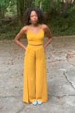 Wore this to a bridal shower and got lots of compliments! Fabric was better than I thought it'd be. I do think it's a little tough to sit down in,  the split comes open, exposing the thigh, and there's no way around that that I found. But for an event that's mostly standing, it's perfect. And between the adjustable straps and the tie back, I think it would fit most people. I will say I like my bottoms long so I didn't feel like I could wear heels with it. But I'm 5'7 and have long legs so that may have been an issue others won't run into. And who WANTS to wear heels anyway? - Krystle D.