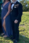 Absolutely loved the dress. It's comfortable and fits true to size. I got it hemmed about two inches because I wasn't wearing heels with it. The color is definitely more bluish than it looks in most pictures. - Erin M.