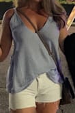 I am 5'4" and 120lbs.  I LOVE this top!  I want all the colors :) I normally wear a small/medium top-I decided to get a small and I wasn't disappointed.  It fit great.  Very light weight but quality material.  I wore pasties and it worked out fine.  Looks great dressed up or down. Can't wait for more colors to be restocked! - Brandy V.