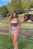 Bought this for my daughters homecoming! It has a nice stretch to it. She is athletic built and even as a size 6/8 the medium had plenty of stretch. Loved it and received tons of compliments. Super comfortable all night even though she says she did leave sequins everywhere all night. - Rosa H.