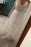 I ordered this dress for my winter elopement and got it shipped to the UK and it arrived really quickly. I fell in love with it as soon as I put it on !! It's very floaty and comfortable with a lovely V neck. It's currently too long on me but will be easy to fix. I got exactly what I expect for the price and I'm happy with my purchase. - Lydia R.