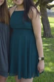 Super pretty color and great for grad photos I took both in and out of direct sunlight. Appreciated that it has an inner lining! I think the top portion ended up riding up a bit but nothing deal-breaking. - Leona L.