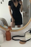 Perfect black wrap dress for any occasion, wish it was a tiiiiny but longer so that it would cover more in the back. - Jessica O.
