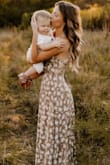 Ordered this dress for getting pictures taken with my son and it was beautiful! I got so many compliments on it and people asking where I got it. It's the perfect length, hits right above the ankle, which was great for me because I don't like floor-length maxis. I LOVED the criss-cross back.
The only complaint I have is that it's superrrr low cut. I thought that since the straps tie in the back that it could be adjusted, but really no matter how tight you make the straps, it still is a very deep V. There were many times I had to adjust myself so that I didn't have a full on nip-slip.
But to me, the risk was worth it lol - Karli G.