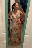 I bought this as a bridesmaid's dress, and I was really impressed! The waist is a little snug. I had been deciding between XS and S, and I'm definitely glad I went with the S. I had to get it hemmed a couple inches, since I'm only 5'4". - Meredith H.