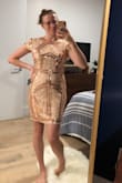 I love this dress! I bought it in a Small and Medium and am opting for the medium. It's not perfectly tailored like a glove, but it is tight enough and the pattern does the rest to define and enhance my body shape. I love a statement dress and never want to wear something simple or boring to big event or night out. This is perfect because the neck line and sleeves keep it classy and balance the sequins and sparkle. Absolutely perfect. - Cargo S.