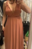 The dress fit perfectly. I was running out of time before a wedding that I am a personal attendant in. The dress came in so fast! Less than 24 hours. I had to pay for rush shipping and it was so worth it. The color of the dress has more orange undertones than a traditional rose, which is perfect for fall! I cannot wait to wear this! I ordered a medium because it said it ran bigger. I am happy I listened to the reviews! The back also has a little bit of elastic to it so it gives you an inch or two to breathe! - Sierra J.