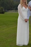 This dress was incredibly comfortable & flattering for my newly pregnant body! I wore it for our post-wedding party, a year after our small wedding (due to COVID) at our family's farm. It was perfect for the chilly night. I also appreciated that it was form-fitting in the bust, and very loose from the bust down. At the time I was only about 13wks pregnant so I didn't have a massive baby bump yet, but I was definitely bloated & heavier than usual. It was also the perfect length for my tall frame.

The dress got very dirty from walking around outside the entire day, but my mom soaked it in cold water with bleach & detergent first, then put it in a bag in the washing machine on VERY HOT and a HEAVY DUTY cycle (using CAR WASH SOLUTION, LOL) and it cleaned perfectly; you can't tell at all how dirty it was before! I highly doubt that it was recommended to wash it that way but the dress held up perfectly!

The only complaint I have is that the dress lace did easily snag on things. When it snags, it gets fluffy/fuzzy. - Nicole P.