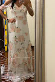 This dress is really pretty on. The waist fits perfect and I'd say it's true to size. The length is long and I would need this hemmed but that is expected since I'm 5'3". (Don't mind my broken mirror!) It is slightly see through but it is lined which helps. - CARLA D.